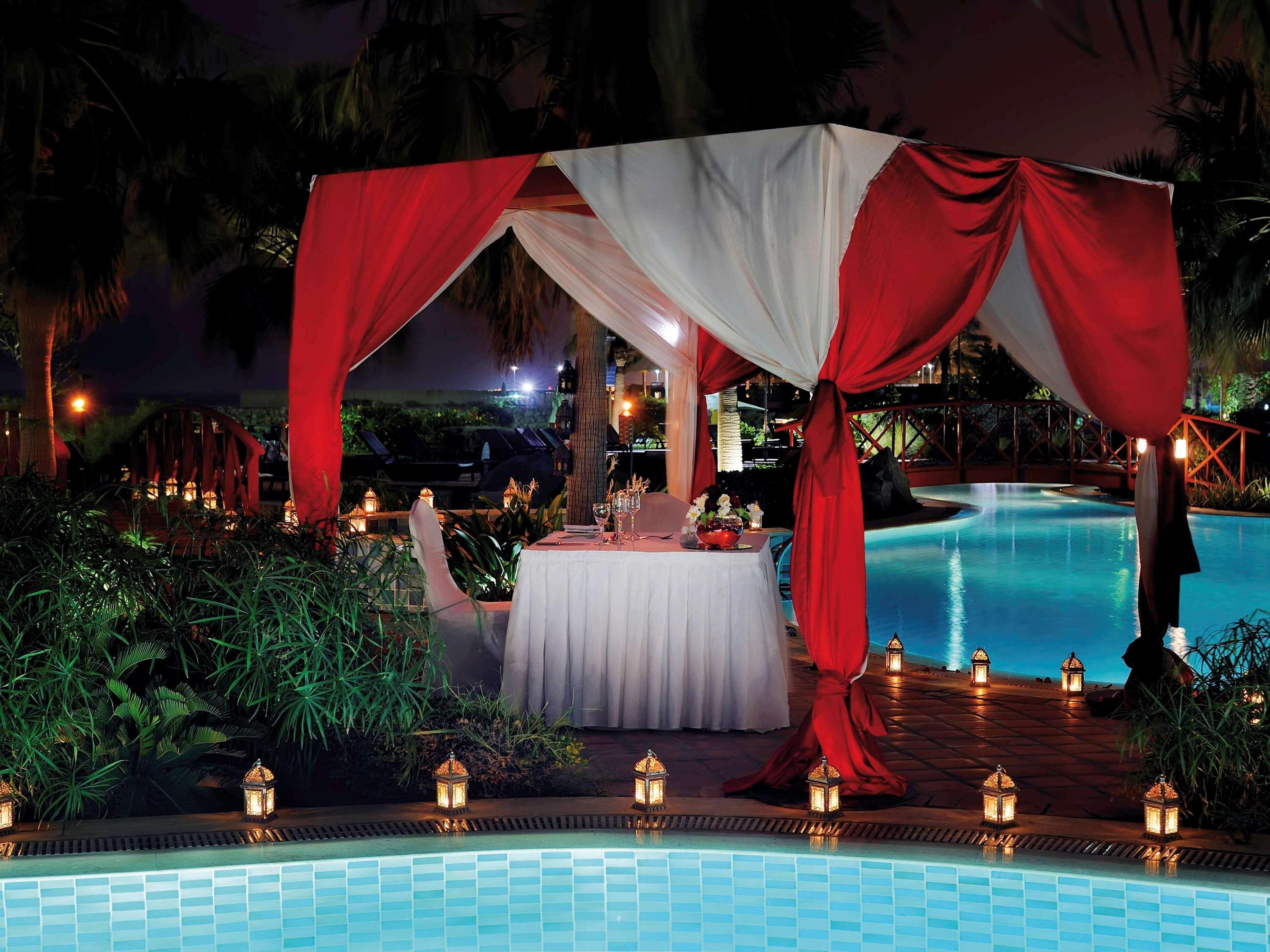 Moevenpick Hotel & Resort Al Bida'A Salmiya Exterior photo A poolside dinner at the Taj Bengal